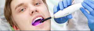Stock Photo of Laser Gum Therapy Being Performed