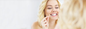 Stock Image of Female Flossing