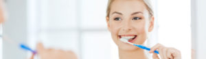Stock Photo of Female Brushing Her Teeth