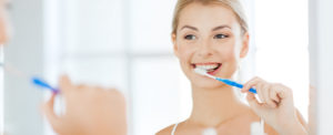 Stock Image of Female Brushing Her Teeth