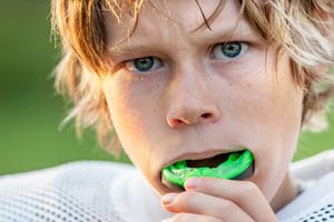 Photo of Boy Putting in his Mouth Guard