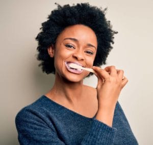 Woman brushing her teeth 